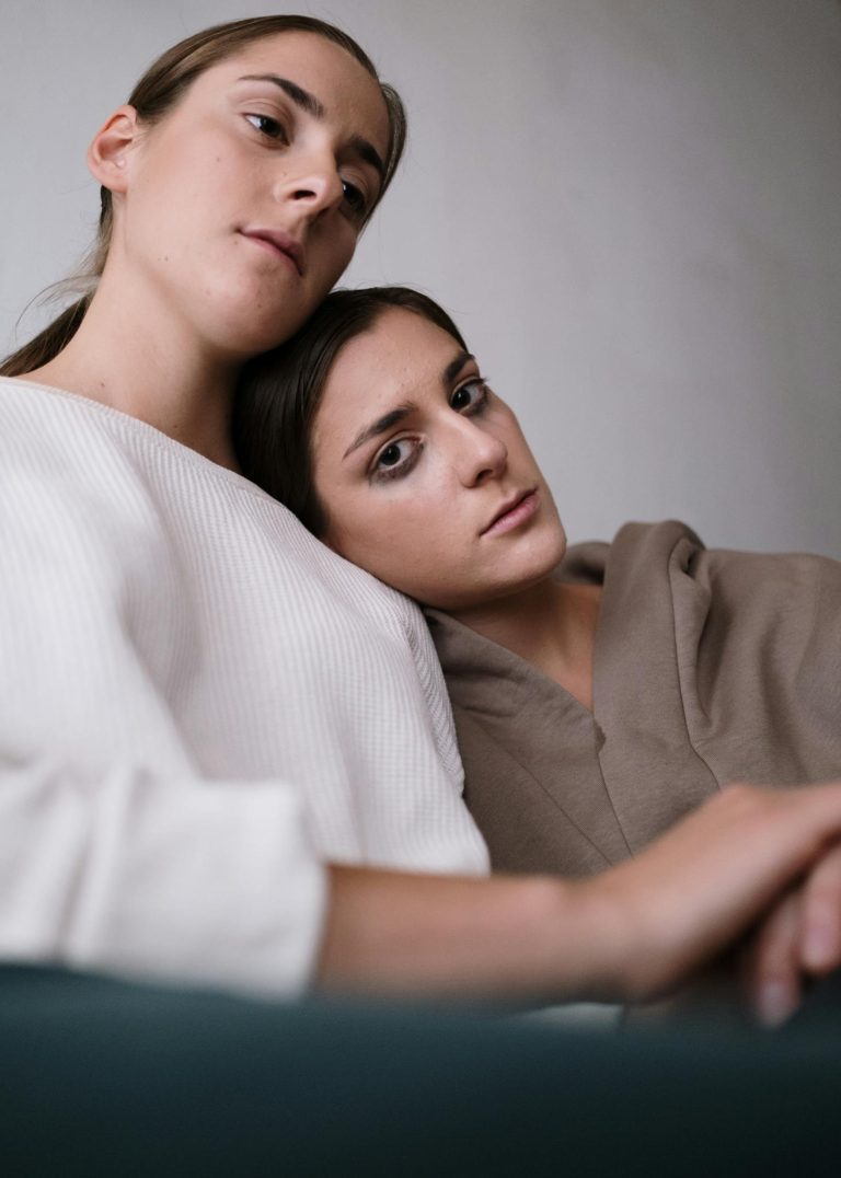 Woman in White Long Sleeve Shirt Beside Man in White Long Sleeve Shirt